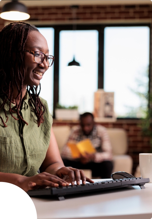 Young woman smiling pressing keyboard